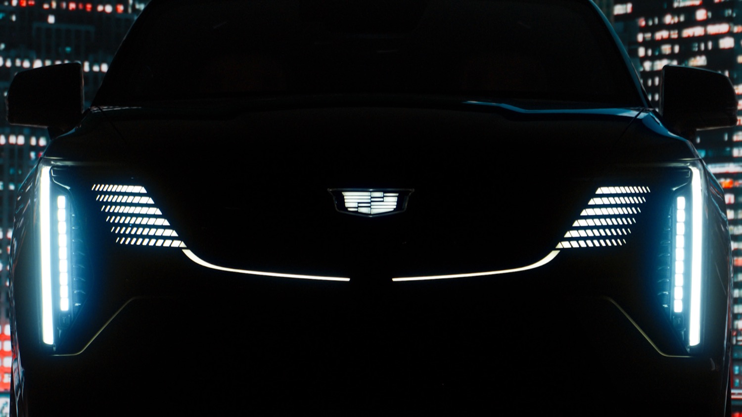 Front view of a Cadillac Escalade IQ with illuminated signature lighting